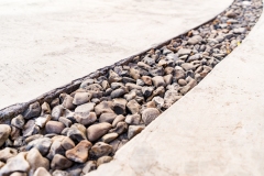 Cement background with pebbles stone